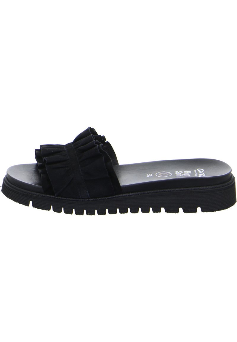 Black sandal featuring a textured fabric upper with a bow detail, a cushioned footbed, and a thick, ridged rubber outsole for grip.