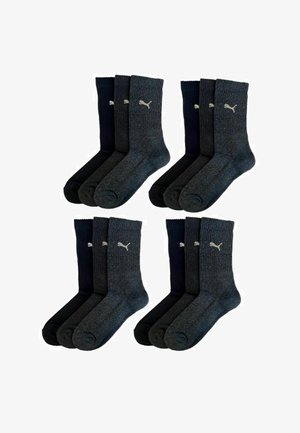 Four pairs of socks: two dark gray and two navy blue, featuring ribbed texture and small logo on the side, made of a cotton blend.