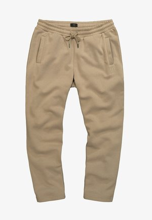 Beige joggers van een zachte stof, elastische tailleband met trekkoord en twee zijzakken. Subtiele merkdetail op het been.