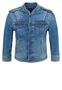 Jeansjacka i ljusblått, med ståkrage, två bröstfickor och knäppning med knappar. Tyget har lätt blekning och texturvariationer.