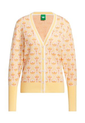 Żółty kardigan w wzory z pomarańczowymi motywami kwiatowymi, dekolt w serek, pięć guzików z przodu oraz ściągacze na rękawach i dole. Cienka, dzianinowa tkanina.