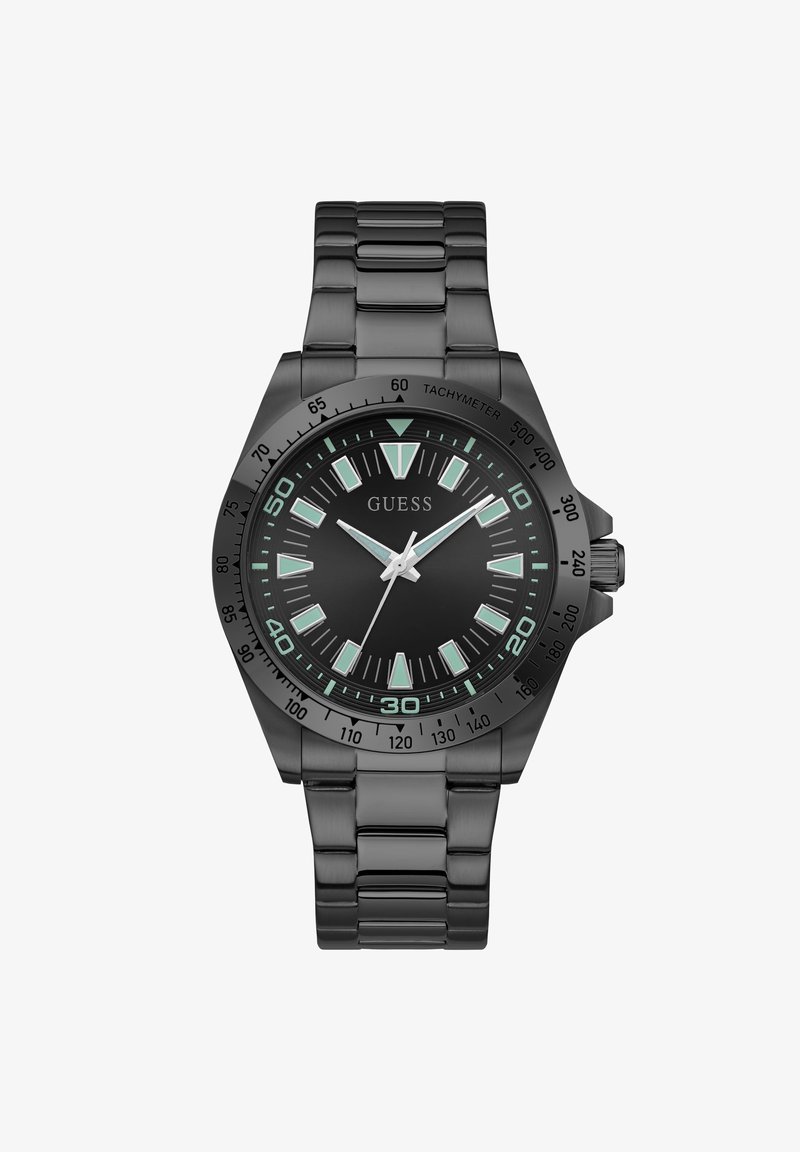 Μαύρο ρολόι Guess από ανοξείδωτο ατσάλι με φωτιζόμενους δείκτες ώρας, τρία δείκτες και στεφάνι ταχυμέτρου σε συνδεδεμένο μπρασελέ.