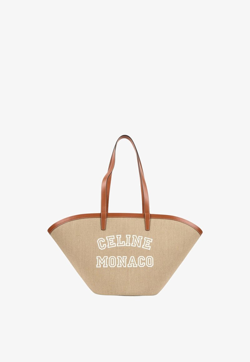 Sac cabas trapèze beige avec des poignées et bordures en cuir marron, avec un texte blanc ""CELINE MONACO"" sur le devant.