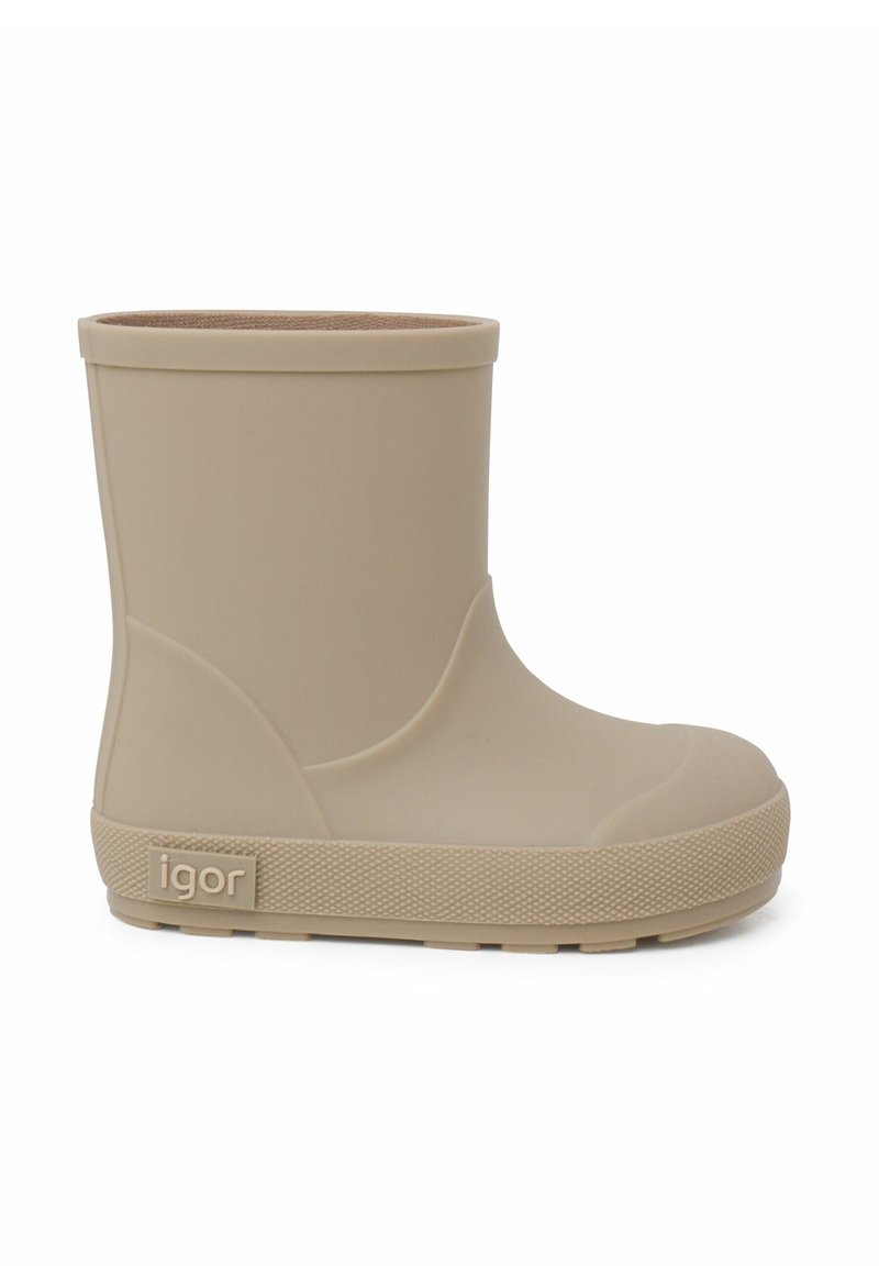 Botte de pluie en caoutchouc beige, à cheville, avec une texture lisse, un bout arrondi, un petit talon et un logo discret sur le côté. Design simple et fonctionnel.
