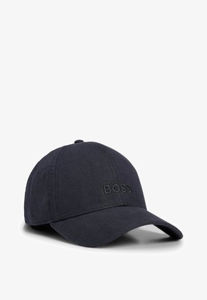 Navy blue baseball cap made from textured fabric, featuring an embroidered "BOSS" logo on the front and a curved visor.