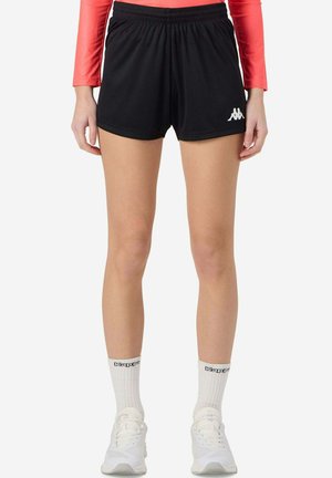 Pantaloni sportivi neri con cintura elastica e spacco laterale. Presentano un logo Kappa bianco sulla parte sinistra. Tessuto liscio e leggero.