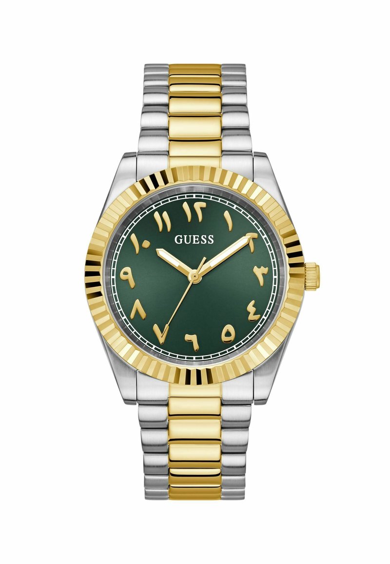 Montre en acier inoxydable doré et argenté avec un cadran vert, des chiffres arabes dorés, une lunette dorée cannelée et un bracelet en maillons métalliques.
