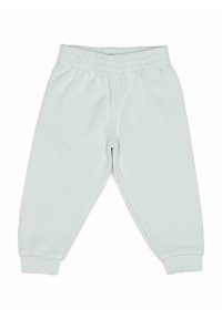 Pantalon de survêtement vert clair en tissu doux, avec une taille et des poignets élastiques, offrant une coupe décontractée avec une texture lisse.