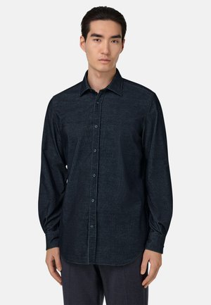 Donkerblauw shirt met lange mouwen, gemaakt van textuurstof, met een knoopsluiting aan de voorkant, een puntige kraag en een gebogen zoom.