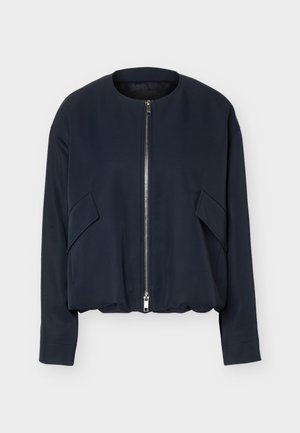 Navy blue long-sleeve jacket with round collar, front silver zipper, and angled flap pockets on each side against white background.