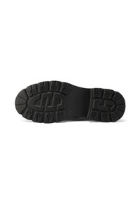Sole in gomma nera con un motivo di trazione distintivo, caratterizzato da tacche circolari e un'area centrale liscia. Finitura resistente e testurizzata.