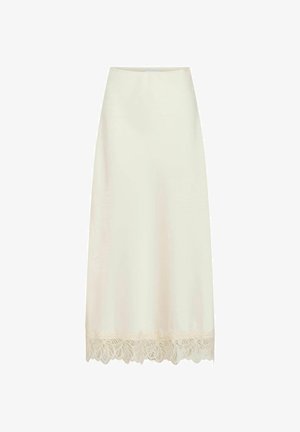 Krēmkrāsas maksi svārki ar gludu satīna apdari un mežģīņu apmales detaļu. Dizains ir vienkāršs un tīši pieguļošs.