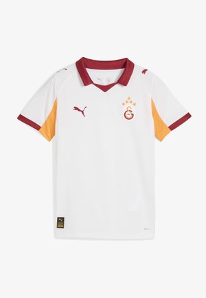 Vit kortärmad fotbollströja med röda och orange detaljer, V-ringning, Puma-logotyp och klubbemblem med stjärnor och text.