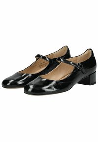 Scarpe basse in vernice nera, con tacco basso, punta arrotondata e cinturino regolabile sul davanti. Finitura liscia e minimalismo negli embellishments.