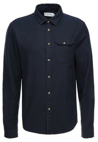 Mörkblå knappert skjorta i ett strukturerat tyg, med långa ärmar, krage, en enda bröstficka och ljusa knappar.