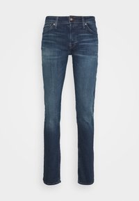 Mörkblå jeans i denim med rak benstil, utrustade med knappstängning och fem fickor, med subtil blekning och textur.
