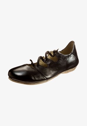 Black leather shoe with a low heel, featuring cut-out design, laces on the side, and a textured beige sole.