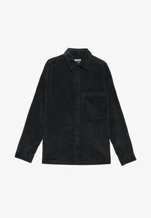 Black corduroy shirt with long sleeves, button closure, collar, and a chest pocket. Soft texture and ribbed surface pattern.