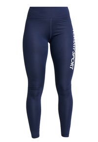 Granatowe legginsy wykonane z elastycznego materiału z wysokim stanem. Na boku pionowo nadrukowane białe logo "TOMMY SPORT".