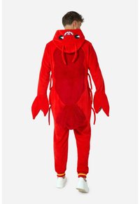 Red lobster-themed onesie with a soft, plush texture, large claws as sleeves, and a hood featuring eyes and antennae. White shoes displayed.