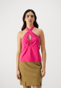 Fuchsia halter top with a knotted accent and a circular cutout. Made from smooth, stretchy material, features a sleek design.