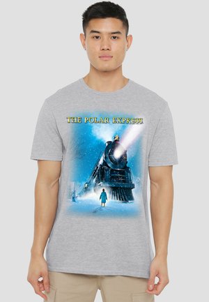 Man wearing gray t-shirt with colorful graphic of a snowy night, a steam train, and a child with "The Polar Express" text.