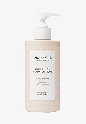 Flacon de lotion corporelle adoucissante, rose pâle avec un texture florale. L'étiquette blanche indique "vanille mandarine", contenant du beurre de karité, de l'huile de jojoba, et de l'aloe vera.
