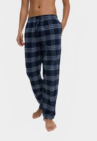 Námořnické kárované společenské kalhoty s páskem na stažení v pase. Měkký materiál s světle modrými a bílými kostkovanými vzory. Volný střih, rovný střih nohavic.