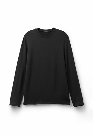 T-shirt noir à manches longues en tissu doux et extensible. Il présente un col rond et une coupe décontractée sans coutures visibles.