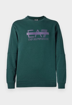Green sweatshirt made of soft fabric featuring a purple graphic design with "EA7" and "EMPORIO ARMANI" text. Ribbed cuffs and hem.