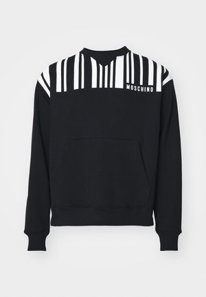 Sweatshirt noir avec des rayures verticales blanches sur les épaules, une poche frontale et le logo "Moschino" sur la poitrine. Fabriqué en tissu doux.