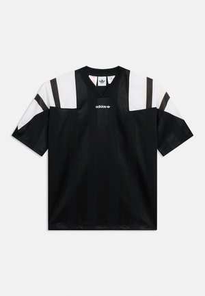 Fekete-fehér Adidas sportmez rövid ujjal, fekete V-nyakú gallérral és az Adidas logóval a mellkason.