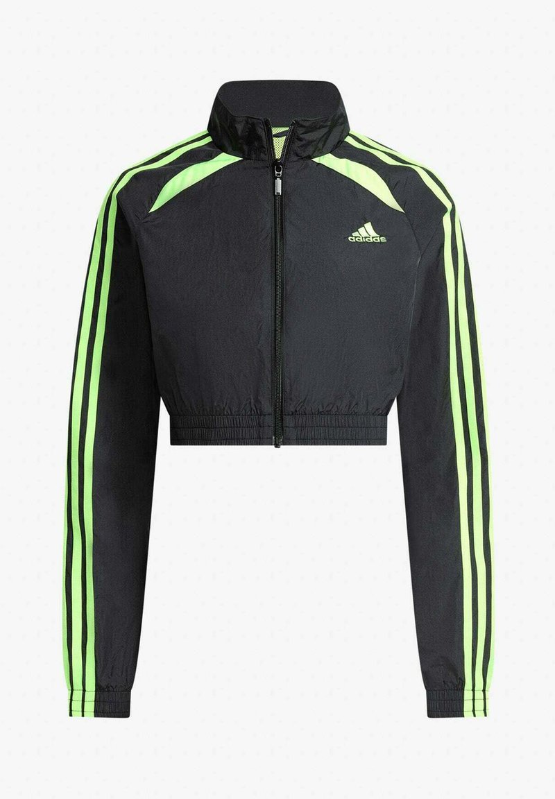 Svart croppad Adidas-jacka med neongröna ränder på ärmar och axlar, dragkedja framtill och Adidas-logga på bröstet.