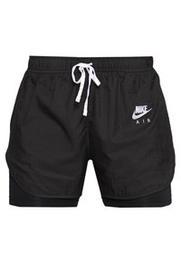 Pantalones cortos negros de Nike con cordón blanco, que cuentan con una capa exterior y un forro interior incorporado. Logo exhibido "NIKE AIR" en blanco.