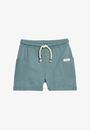 Petrolkleurige katoenen peutershort met elastische tailleband, wit trekkoord, twee houten knopen, voorzakken en een klein "newbie" label.