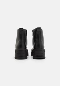 Tommy Jeans Stivaletti con plateau - black