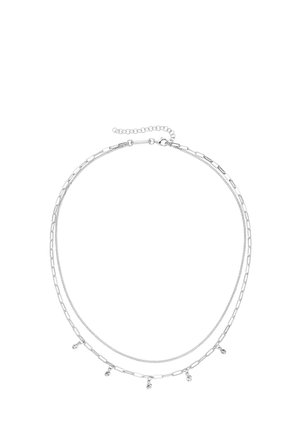 Layered silver necklace featuring a mix of chain styles, including elongated links and delicate strands with small dangling accents.