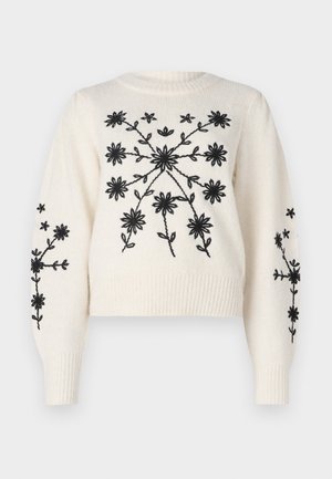 Cremfarbener Pullover mit schwarzem floralem Stickerei, ausgestattet mit einem runden Ausschnitt und gerippten Bündchen. Das Design umfasst florale Muster auf der Vorderseite und den Ärmeln.