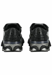 Pair of black and silver metallic sneakers viewed from the back, featuring textured fabric and thick, patterned soles.