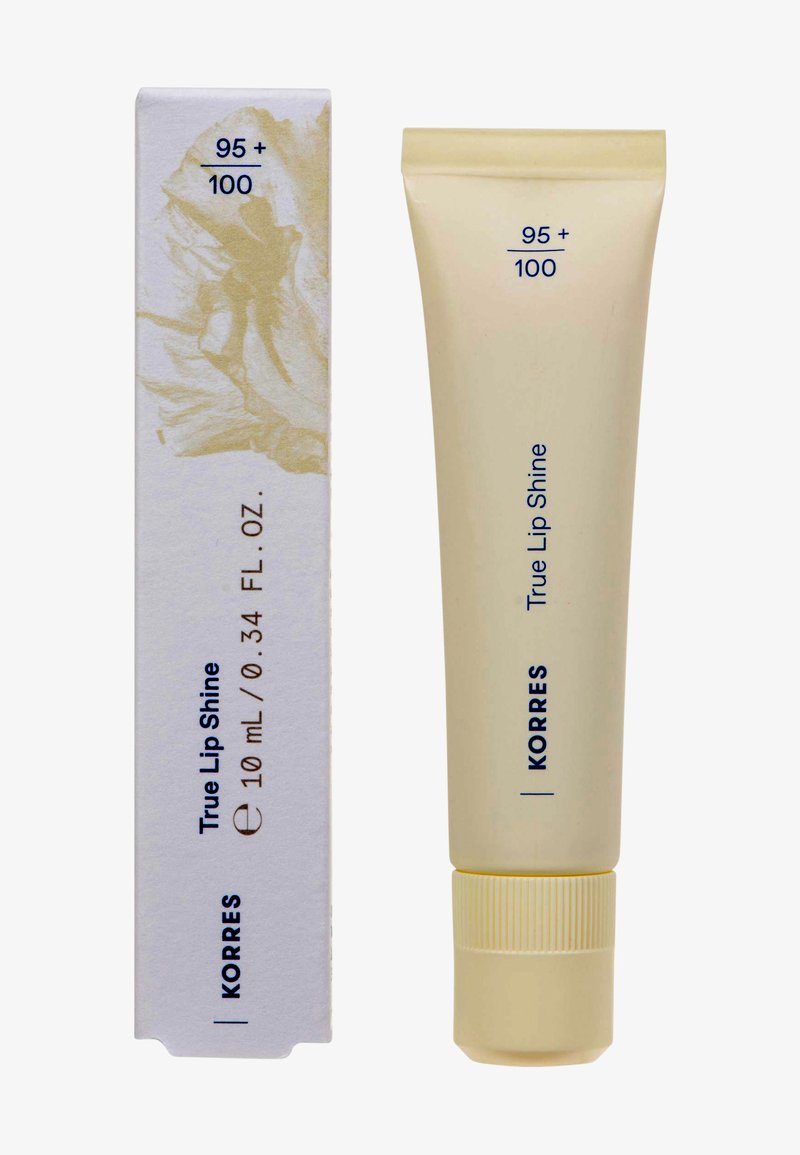 Tubetto di lip gloss Korres True Lip Shine e la confezione abbinata, 10 mL, beige con testo blu scuro e illustrazione di una fata sulla scatola.