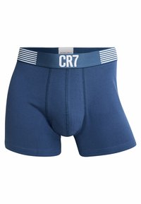Navy blue boxer briefs made of soft fabric, featuring a wide elastic waistband with white stripes and the "CR7" logo in white.