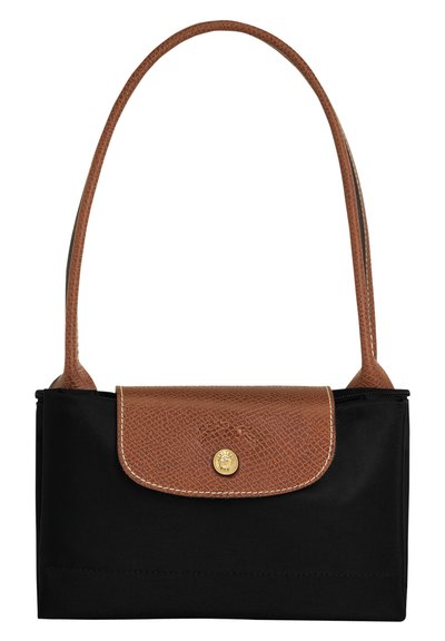 Black fabric handbag with a brown leather flap, gold logo detail, and a long strap. Features a textured surface on the flap.