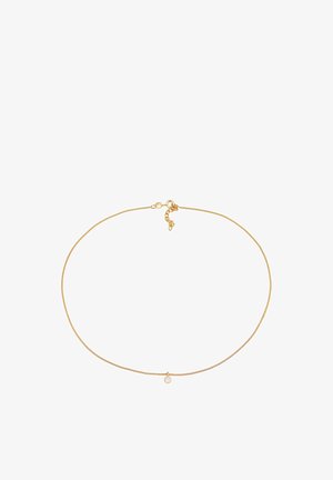 Kuldne kaelakee, millel on õrn ja peen kaablidisain ning väike ümmargune ripats keskel. Omab kindlat homaariklambrit.