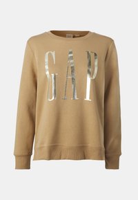 Sudadera color marrón claro con letras metálicas plateadas "GAP". Presenta mangas largas, cuello redondo y tejido texturizado con puños y dobladillo acanalados.