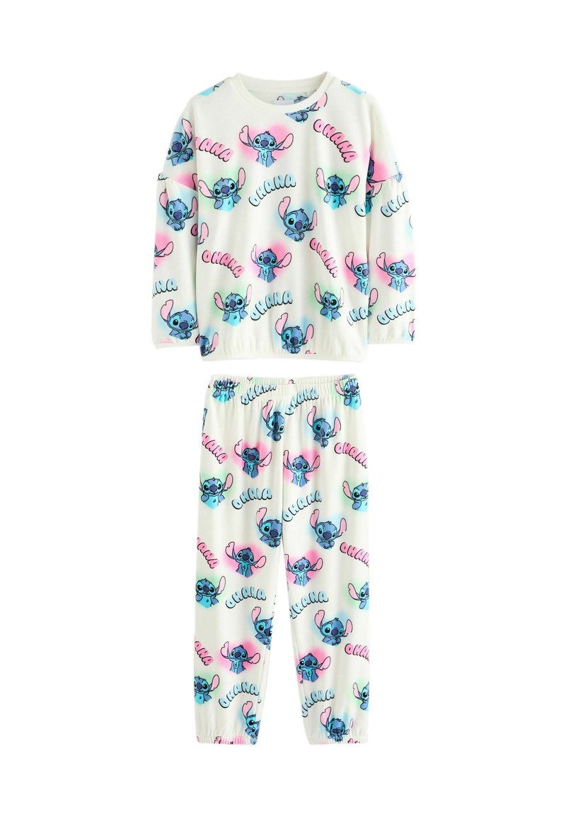 Lasten valkoinen pyjama, jossa on sinisiä ja vaaleanpunaisia sarjakuvamaisia Stitch-naamioita ja "ohana"-tekstikuvio yläosassa ja housuissa.