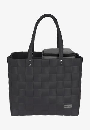 Black woven tote bag with two handles, featuring a zippered gray compartment on top and a branded label. Smooth, textured material.
