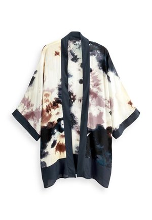 Kimono de couleur claire avec bordure noire et motifs abstraits en aquarelle noire, marron et beige, manches larges et amples, devant ouvert.