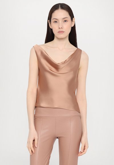 Cowl-neck satin top in soft brown, sleeveless design with a smooth texture; paired with matching fitted pants.