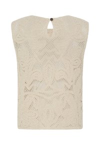 Top en dentelle crochetée sans manches de couleur crème avec motifs floraux et géométriques et petite fermeture par bouton à l'arrière de l'encolure.