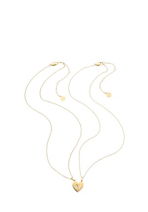 Two gold necklaces with thin chains and matching pendants forming a split heart with small embedded stones.